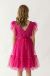 Side view of fuchsia tulle girls dress with full skirt