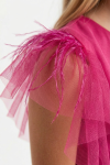 Tulle overlay fabric close-up of fuchsia girls dress