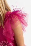 Girl styled in fuchsia Gabi occasion dress for a celebration