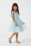 Girl styled in light blue Rina party dress for a family celebration