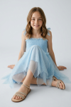 Light blue Suzi girls dress side profile, flared midi cut
