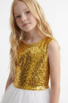 Riva white and gold party dress – gold sequin top with a high round neckline, waist-up close-up