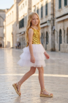 Riva white and gold party dress outdoors – sequin top and layered tulle skirt, side view