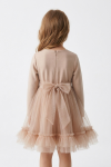 Iga beige tulle dress – back view with concealed zip and tulle sash tied in a big bow