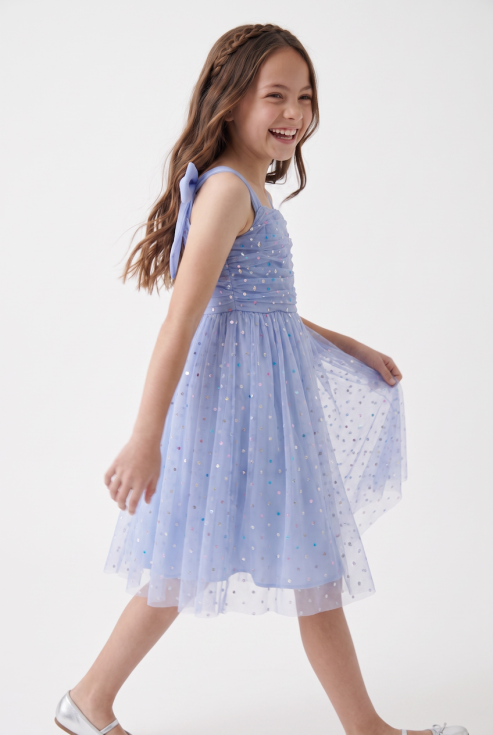 Rina girls' light cornflower blue party dress in tulle with coloured sequins – girl in motion, side view