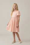 Sia pink knee-length dress – full-length front view on a studio background