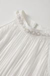 Rozalia white dress – detail of the stand-up collar with pearls and small beads in a wavy pattern