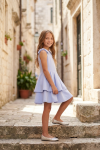 Harper light blue dress with two-layer skirt outdoors – full length