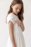 Rumi white dress – tulip sleeve and gathered skirt below the waist seam, side view