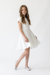 Rumi white dress – knee-length flared skirt in motion, front view