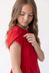 Rumi red dress – close-up of the tulip sleeve and round neckline