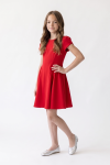 Rumi red party dress – three-quarter view, fitted top and flared skirt