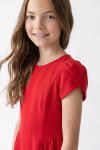 Rumi girls' red dress – tulip sleeve and fabric texture, three-quarter view