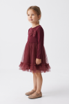 Iga burgundy party dress with long sleeves – three-quarter side view, full length