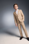 Liam beige boys' set – buttoned blazer, hand in pocket, three-quarter front view