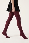 Girls' burgundy 40 denier tights – on a model in motion, side view